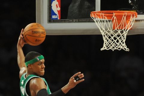 Boston Celtics player Rajon Rondo collects a LA Lakers rebound before the Boston Celtics went on to win 103-94 in game two of the NBA finals at the Staples Center in Los Angeles on June 6, 2010.  The defending champion Los Angeles Lakers are not only seeking their 16th NBA championship but also redemption after a humbling loss to the Boston Celtics in the 2008 NBA finals. The Lakers still have the bitter after taste of their humiliating finals loss two years ago.                AFP PHOTO/Mark RALSTON (Photo credit should read MARK RALSTON/AFP/Getty Images)