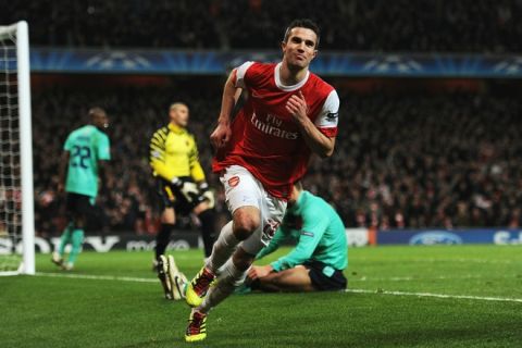 LONDON, ENGLAND - FEBRUARY 16:  Robin van Persie of Arsenal celebrates Arsenal's first goal during the UEFA Champions League round of 16 first leg match between Arsenal and Barcelona at the Emirates Stadium on February 16, 2011 in London, England.  (Photo by Jasper Juinen/Getty Images)