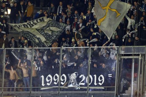 A few bare chested Rosenborg fans brave the cold during the group D Europa League soccer match between PSV and Rosenborg at the Philips stadium in Eindhoven, Netherlands, Thursday, Dec. 12, 2019. (AP Photo/Peter Dejong)