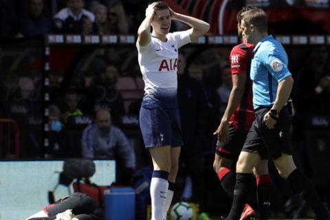 Tottenham's Juan Foyth, reacts after Referee Craig Pawson showed him a red card during the English Premier League soccer match between AFC Bournemouth and Tottenham Hotspur at the Vitality Stadium in Bournemouth, England, Saturday May 4, 2019. (AP Photo/Matt Dunham)