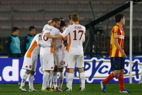 LECCE, ITALY - MARCH 04:  Mirko Vucinic of Roma celebrates with team mates after scoring the opening goal during the Serie A match between US Lecce and AS Roma at Stadio Via del Mare on March 4, 2011 in Lecce, Italy.  (Photo by Maurizio Lagana/Getty Images)