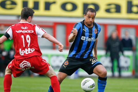 20120408 - KORTRIJK, BELGIUM: Kortrijk's Brecht Dejaegere and Club's Vadis Odjidja Ofoe fight for the ball during the Jupiler Pro League match of Play-Off group 1, between KV Kortrijk and Club Brugge KV, in Kortrijk, Sunday 08 April 2012, on day 2 of the Play-Off 1 of the Belgian soccer championship. BELGA PHOTO BRUNO FAHY