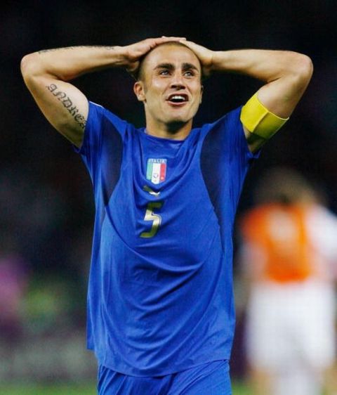 BERLIN - JULY 09:  Fabio Cannavaro of Italy reacts following his team's victory in a penalty shootout at the end of the FIFA World Cup Germany 2006 Final match between Italy and France at the Olympic Stadium on July 9, 2006 in Berlin, Germany.  (Photo by Shaun Botterill/Getty Images)