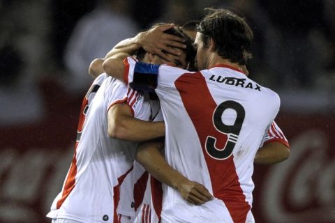 River Plate's defender Juan Diaz (L) celebrates with teammate forward Fernando Cavenaghi (R) after scoring a goal against Chacarita during their Argentine Second Division football match at the Monumental stadium in Buenos Aires, Argentina, on August 16, 2011. River Plate debuts on the Second Division after being relegated for the first time since its foundation in 1901. AFP PHOTO / Juan Mabromata (Photo credit should read JUAN MABROMATA/AFP/Getty Images)