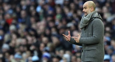 Manchester City manager Josep Guardiola gives instructions to his players during the English Premier League soccer match between Manchester City and Chelsea at Etihad stadium in Manchester, England, Sunday, Feb. 10, 2019. (AP Photo/Jon Super)