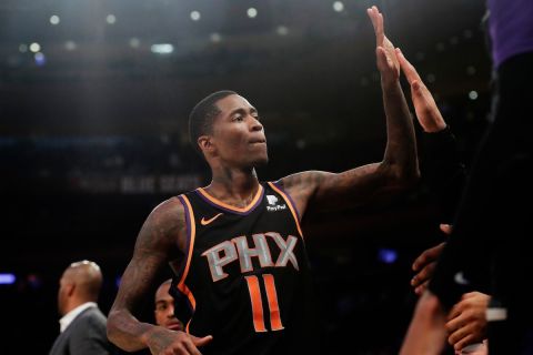 Phoenix Suns' Jamal Crawford (11) celebrates with teammates during the second half of an NBA basketball game against the New York Knicks Monday, Dec. 17, 2018, in New York. The Suns won 128-110. (AP Photo/Frank Franklin II)