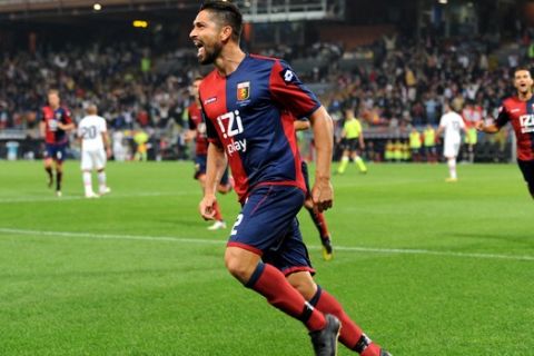 Genoa striker Marco Borriello celebrates after scoringduring a Serie A soccer match between Genoa and Palermo, at Genoa's Luigi Ferraris Stadium, Italy, Saturday, Oct. 6, 2012. (AP Photo/Tanopress)