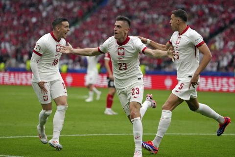 Poland's Krzysztof Piatek (23) celebrates after scoring during a Group D match between Poland and Austria at the Euro 2024 soccer tournament in Berlin, Germany, Friday, June 21, 2024. (AP Photo/Sunday Alamba)