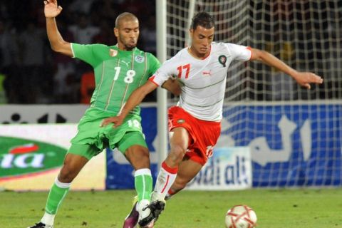 Algerian Kaled Limouchia (R) vies for the ball with Morocco's Marouane Chamakh (L) during the  match for the 2012 African Cup of Nations football tournament between Morocco and Algeria in Marrakesh on June 4, 2011. Morocco won 4-0. AFP PHOTO/ABDELHAK SENNA (Photo credit should read ABDELHAK SENNA/AFP/Getty Images)