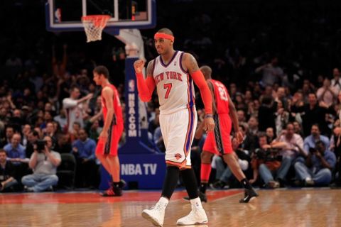 NEW YORK, NY - MARCH 30:  Carmelo Anthony #7 of the New York Knicks celebrates during the game against the New Jersey Nets at Madison Square Garden on March 30, 2011 in New York City. NOTE TO USER: User expressly acknowledges and agrees that, by downloading and/or using this Photograph, User is consenting to the terms and conditions of the Getty Images License Agreement. Then Knicks defeated the Nets 120-116  (Photo by Chris Trotman/Getty Images)