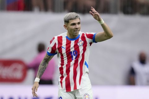 Paraguay's Julio Enciso celebrates scoring his side's first goal against Colombia during a Copa America Group D soccer match in Houston, Monday, June 24, 2024. (AP Photo/Kevin M. Cox)