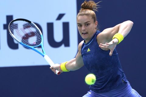 Maria Sakkari, of Greece, hits a return to Naomi Osaka, of Japan, during the quarterfinals of the Miami Open tennis tournament, Wednesday, March 31, 2021, in Miami Gardens, Fla. Sakkari won 6-0, 6-4. (AP Photo/Lynne Sladky)