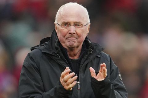 Former England manager Sven-Goran Eriksson applauds the crowd after an exhibition soccer match between Liverpool Legends and Ajax Legends at Anfield Stadium, Liverpool, England, Saturday March 23, 2024. Former England boss Eriksson, who is a lifelong Liverpool fan, disclosed his terminal cancer diagnosis in January. (AP Photo/Jon Super)