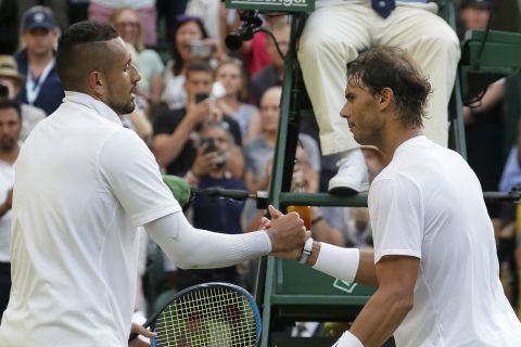 Spain's Rafael Nadal, right, greets Australia's Nick Kyrgios at the net after beating him in a Men's singles match during day four of the Wimbledon Tennis Championships in London, Thursday, July 4, 2019. (AP Photo/Kirsty Wigglesworth)