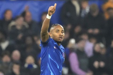 Chelsea's Christopher Nkunku celebrates scoring his side's seventh goal during the Europa Conference League opening phase soccer match between Chelsea and FC Noah at Stamford Bridge stadium in London Thursday, Nov. 7, 2024. (AP Photo/Frank Augstein)