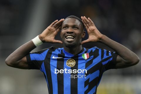 Inter Milan's Marcus Thuram celebrates scoring his side's opening goal during the Serie A soccer match between Inter Milan and Torino at the San Siro Stadium, in Milan, Italy, Saturday, Oct. 5, 2024. (AP Photo/Antonio Calanni)