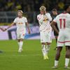 Leipzig players stand dejected after the German Bundesliga soccer match between Borussia Dortmund and RB Leipzig at the Signal-Iduna Park in Dortmund, Germany, Saturday, Nov. 2, 2024. (AP Photo/Martin Meissner)