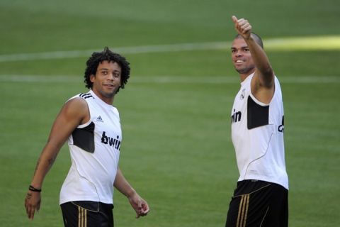 Real Madrid's defender Marcelo (L) and Real Madrid's defender Pepe take part in a training session at Santiago Bernabeu stadium in Madrid on August 13, 2011, on the eve of the Supercup first leg football match against FC Barcelona. AFP PHOTO / DANI POZO (Photo credit should read DANI POZO/AFP/Getty Images)