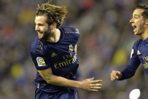 Real Madrid's Nacho, left, reacts after scoring his side's opening goal during a Spanish La Liga soccer match between Valladolid and Real Madrid at the Jose Zorrilla stadium in Valladolid, Spain, Sunday Jan. 26, 2020. (AP Photo/Ricardo Ordonez)