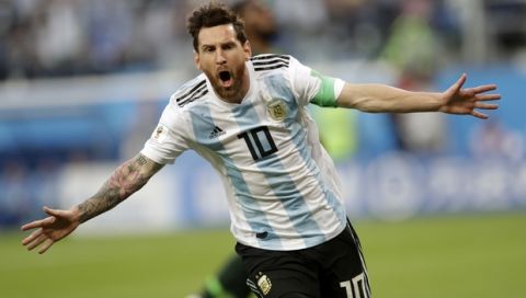 Argentina's Lionel Messi celebrates after scoring the opening goal of his team during the group D match between Argentina and Nigeria, at the 2018 soccer World Cup in the St. Petersburg Stadium in St. Petersburg, Russia, Tuesday, June 26, 2018. (AP Photo/Petr David Josek)