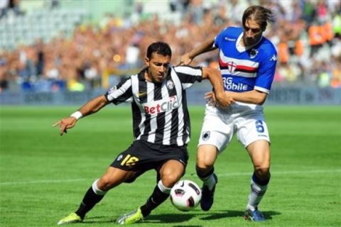 Juventus' Fabio Quagliarella, left, vies for the ball with Sampdoria's Daniele Gastaldello during a Serie A soccer match between Juventus and Sampdoria at the Olympic Stadium in Turin, Italy, Sunday, Sept.12, 2010. (AP Photo/Massimo Pinca)