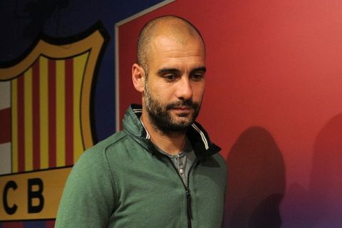 FC Barcelona's coach Pep Guardiola gives a press conference at Camp Nou stadium in Barcelona on April 20, 2012, on the eve of the Spanish League "El clasico" football match Real Madrid vs Barcelona. AFP PHOTO / LLUIS GENE (Photo credit should read LLUIS GENE/AFP/Getty Images)