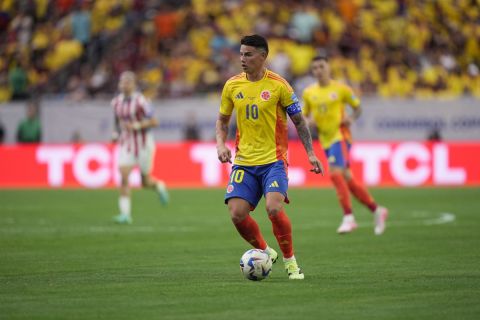 Colombia's James Rodriguez brings the ball up the field against Paraguay during a Copa America soccer match Monday, June 24, 2024, in Houston. (AP Photo/David J. Phillip)