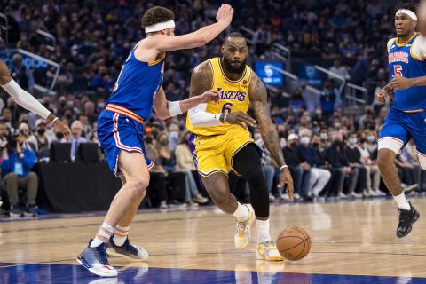 Los Angeles Lakers forward LeBron James (6) drives past Golden State Warriors guard Klay Thompson, left, during the first half of an NBA basketball game in San Francisco, Saturday, Feb. 12, 2022. (AP Photo/John Hefti)