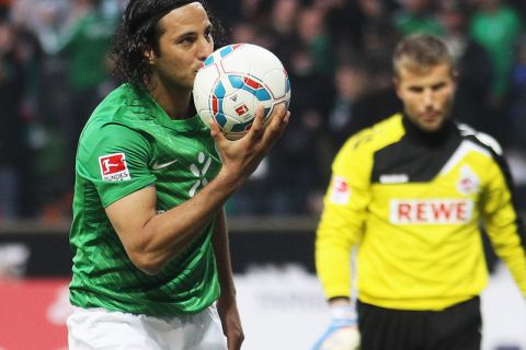 BREMEN, GERMANY - NOVEMBER 05:  Claudio Pizarro of Bremen celebrates after scoring his team's second goal during the Bundesliga match between Werder Bremen and 1. FC Koeln at Weser Stadium on November 5, 2011 in Bremen, Germany.  (Photo by Joern Pollex/Bongarts/Getty Images)