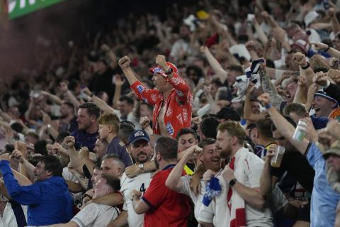 Fans celebrate after England's Ollie Watkins scores his side's 2nd goal against Netherlands during a semifinal at the Euro 2024 soccer tournament in Dortmund, Germany, Wednesday, July 10, 2024. (AP Photo/Thanassis Stavrakis)