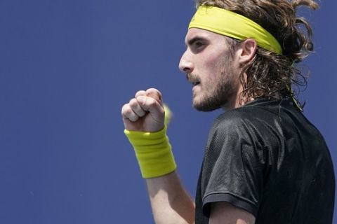 Stefanos Tsitsipas of Greece celebrates a point against Damir Dzumhur of Bosnia during the Miami Open tennis tournament, Saturday, March 27, 2021, in Miami Gardens, Fla. (AP Photo/Marta Lavandier)