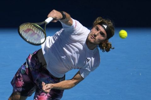 Stefanos Tsitsipas of Greece plays a forehand return to Karen Khachanov of Russia during their semifinal at the Australian Open tennis championship in Melbourne, Australia, Friday, Jan. 27, 2023. (AP Photo/Ng Han Guan)