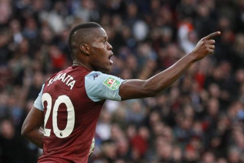 Aston Villa's Mbwana Samatta celebrates scoring his side's first goal during the League Cup soccer match final between Aston Villa and Manchester City, at Wembley stadium, in London, England, Sunday, March 1, 2020. (AP Photo/Ian Walton)