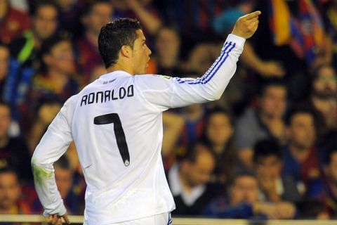 Real Madrid's Portuguese forward Cristiano Ronaldo celebrates after scoring during the Spanish Cup final match Real Madrid against Barcelona at the Mestalla stadium in Valencia on April 20, 2011.  AFP PHOTO / LLUIS GENE (Photo credit should read LLUIS GENE/AFP/Getty Images)