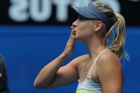 WCENTER 0SNBBENAEO                Russia's Maria Sharapova blows a kiss to the crowd following her win over compatriot Olga Puchkova in their first round match at the Australian Open tennis championship in Melbourne, Australia, Monday, Jan. 14, 2013. (AP Photo/Andrew Brownbill) 