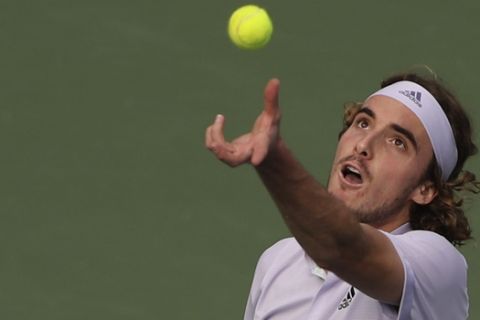 Stefanos Tsitsipas of Greece serves to Kazakhstan's Alexander Bublik during a match of the Dubai Duty Free Tennis Championship in Dubai, United Arab Emirates, Wednesday, Feb. 26, 2020. (AP Photo/Kamran Jebreili)