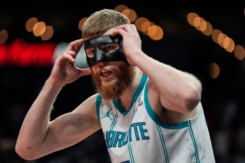 Charlotte Hornets forward Davis Bertans (9) reacts to a call against the Atlanta Hawks during the first half of an NBA basketball game, Wednesday, April 10, 2024, in Atlanta. (AP Photo/Mike Stewart)