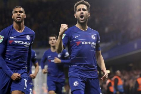 Chelsea's Cesc Fabregas, right, celebrates scoring his side's third goal of the game during the English League Cup 4th round soccer match between Chelsea and Derby County in London, Wednesday, Oct. 31, 2018. (Nick Potts/PA via AP)