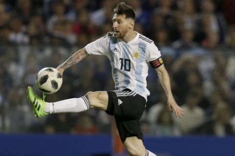 Argentina's Lionel Messi controls the ball during a friendly soccer match between Argentina and Haiti at the Bombonera stadium in Buenos Aires, Argentina, Tuesday, May 29, 2018. (AP Photo/Natacha Pisarenko)