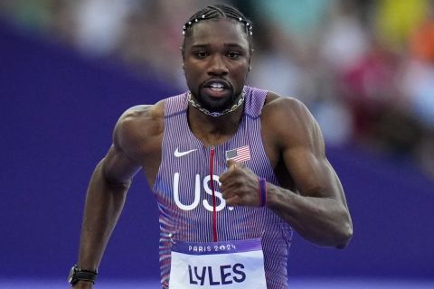 Noah Lyles, of the United States, competes during a heat in the men's 100-meter semifinal at the 2024 Summer Olympics, Sunday, Aug. 4, 2024, in Saint-Denis, France. (AP Photo/Petr David Josek)