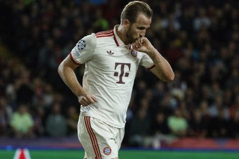 Bayern's Harry Kane, celebrates after scoring his side first goal during a Champions League opening phase soccer match between Barcelona and Bayern Munich at the Lluis Companys Olympic Stadium in Barcelona, Spain, Wednesday, Oct. 23, 2024. (AP Photo/Joan Monfort)