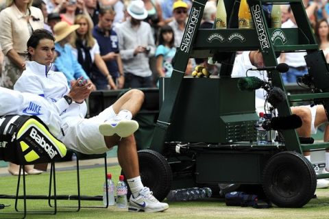 Spanish player Rafael Nadal reacts after losing to Serbian player Novak Djokovic during the men's single final at the Wimbledon Tennis Championships at the All England Tennis Club, in southwest London on July 3, 2011. Djokovic won 6-4, 6-1, 1-6, 6-3.  AFP PHOTO / GLYN KIRK
RESTRICTED TO EDITORIAL USE (Photo credit should read GLYN KIRK/AFP/Getty Images)