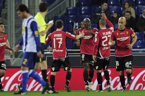 Mallorca's Cameroonian forward Pierre Webo (C) celebrates with his teamates after scoring against Mallorca during their Spanish league football match on March 1, 2011 at the Cornella-El Prat stadium in Cornella de Llobregat.   AFP PHOTO/ JOSEP LAGO (Photo credit should read JOSEP LAGO/AFP/Getty Images)