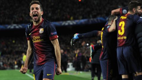 Barcelona's defender Jordi Alba celebrates after scoring during the UEFA Champions League round of 16 second leg football match FC Barcelona against AC Milan at Camp Nou stadium in Barcelona on March 12, 2013. Barcelona won 4-0.  AFP PHOTO / LLUIS GENE        (Photo credit should read LLUIS GENE/AFP/Getty Images)