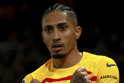 Barcelona's Raphinha celebrates scoring his side's second goal during the Champions League quarterfinal first leg soccer match between Paris Saint-Germain and Barcelona at the Parc des Princes stadium in Paris, Wednesday, April 10, 2024. (AP Photo/Aurelien Morissard)