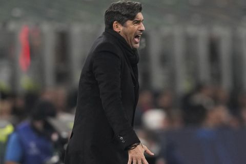 AC Milan's head coach Paulo Fonseca shouts during the Champions League opening phase soccer match between AC Milan and Red Star Belgrade, Crvena Zvezda, at the San Siro stadium in Milan, Italy, Wednesday, Dec. 11, 2024. (AP Photo/Antonio Calanni)