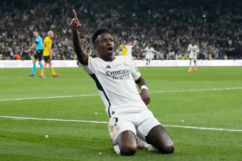 Real Madrid's Vinicius Junior celebrates after scoring his side's second goal during the Champions League final soccer match between Borussia Dortmund and Real Madrid at Wembley stadium in London, Sunday, June 2, 2024. (AP Photo/Frank Augstein)