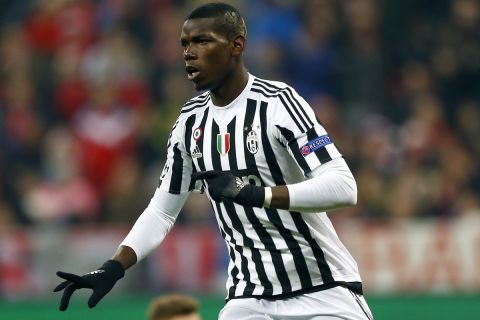 Juventus' Paul Pogba, front left, celebrates after scoring the opening goal during the Champions League round of 16 second leg soccer match between FC Bayern Munich and Juventus Turin in Munich, southern Germany, Wednesday, March 16, 2016. At right is Bayern's David Alaba. (AP Photo/Matthias Schrader)