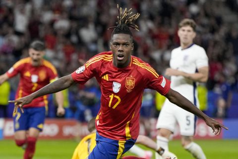 Spain's Nico Williams celebrates after scoring his side's opening goal during the final match between Spain and England at the Euro 2024 soccer tournament in Berlin, Germany, Sunday, July 14, 2024. (AP Photo/Matthias Schrader)