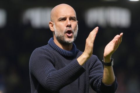 Manchester City's head coach Pep Guardiola celebrates at the end of the English Premier League soccer match between Fulham and Manchester City at the Craven Cottage Stadium in London, Saturday, May 11, 2024. (AP Photo/Kirsty Wigglesworth)